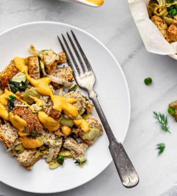 plant based savory bread pudding with nutritional yeast and spinach