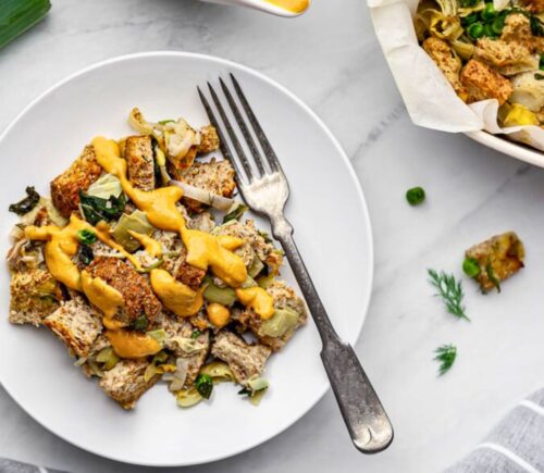 plant based savory bread pudding with nutritional yeast and spinach