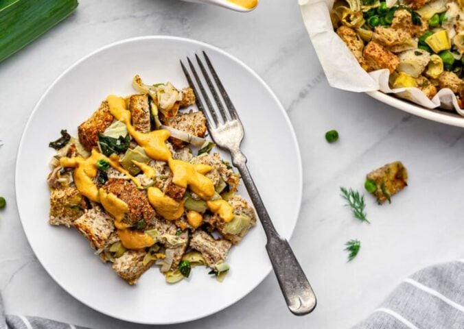 plant based savory bread pudding with nutritional yeast and spinach