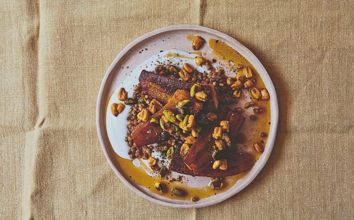 a plate of plantain and brown lentils with hot pistachio and corn nut dressing for high-protein fall recipes
