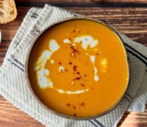 pumpkin soup with carrot, onion, garlic, coconut milk, and lemon