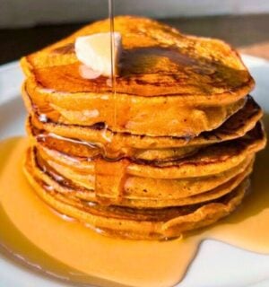pumpkin spiced latte pancakes with ground coffee and maple syrup