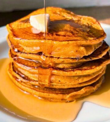 pumpkin spiced latte pancakes with ground coffee and maple syrup