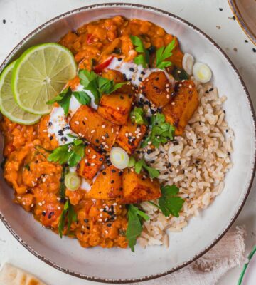 a bowl of creamy roasted butternut squash and spinach dhal for wholesome orange veggie recipes