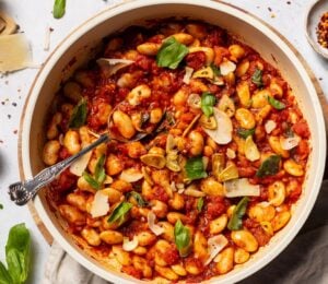 a bowl of spicy arrabbiata butter beans for high-protein vegan recipes whole foods