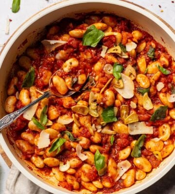 a bowl of spicy arrabbiata butter beans for high-protein vegan recipes whole foods