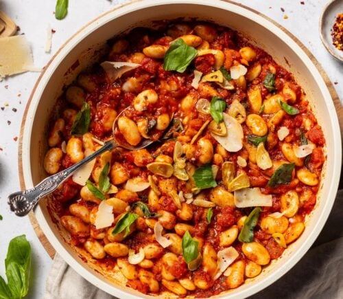 a bowl of spicy arrabbiata butter beans for high-protein vegan recipes whole foods