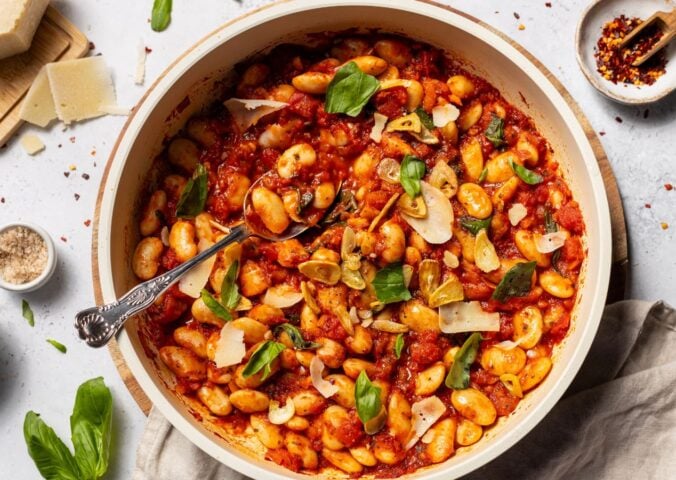 a bowl of spicy arrabbiata butter beans for high-protein vegan recipes whole foods