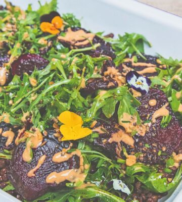spicy lentils and beetroot salad with peanut dressing and rocket