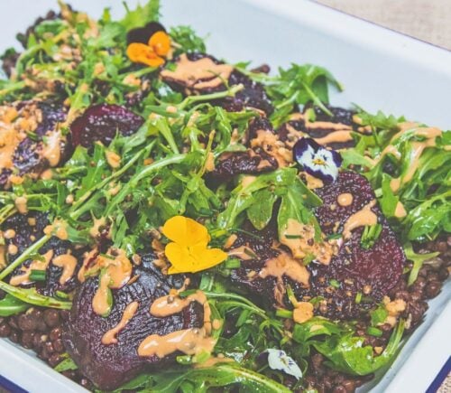spicy lentils and beetroot salad with peanut dressing and rocket