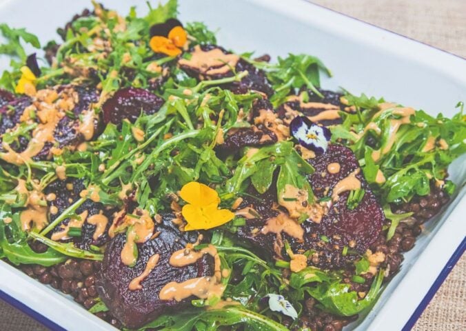 spicy lentils and beetroot salad with peanut dressing and rocket