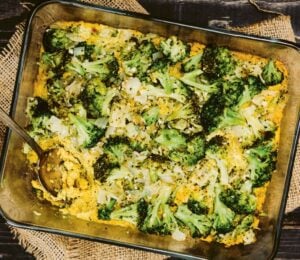 a picture of a vegan cheesy broccoli bake made with silken tofu, nutritional yeast, paprika, and tahini for easy casserole recipes