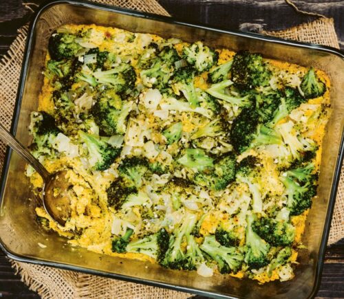 a picture of a vegan cheesy broccoli bake made with silken tofu, nutritional yeast, paprika, and tahini for easy casserole recipes