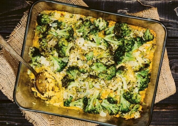 a picture of a vegan cheesy broccoli bake made with silken tofu, nutritional yeast, paprika, and tahini for easy casserole recipes