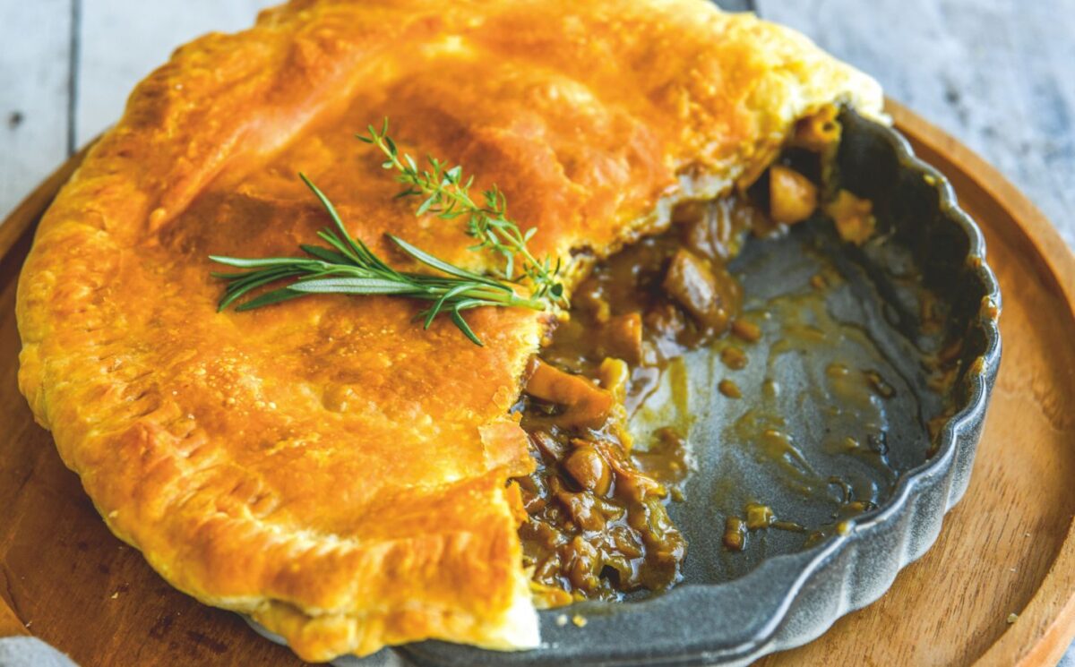 a mushroom and Guinness pie made with vegan puff pastry, cremini mushrooms, Guinness and seasonings for vegan British recipes