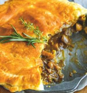 a mushroom and Guinness pie made with vegan puff pastry, cremini mushrooms, Guinness and seasonings for vegan British recipes