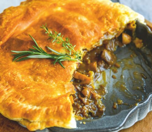 a mushroom and Guinness pie made with vegan puff pastry, cremini mushrooms, Guinness and seasonings for vegan British recipes
