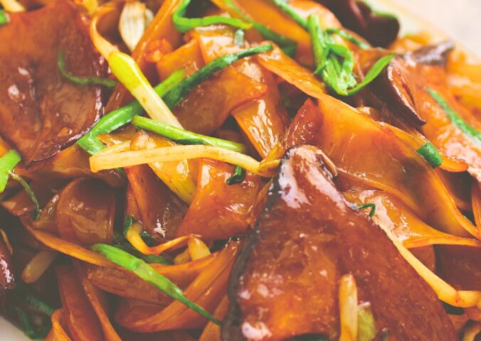 mushroom chow fun with bean sprouts, oyster mushrooms, and dark soy sauce