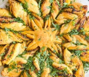 a pesto pastry star made with vegan puff pastry and your choice of pesto