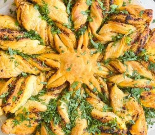 a pesto pastry star made with vegan puff pastry and your choice of pesto