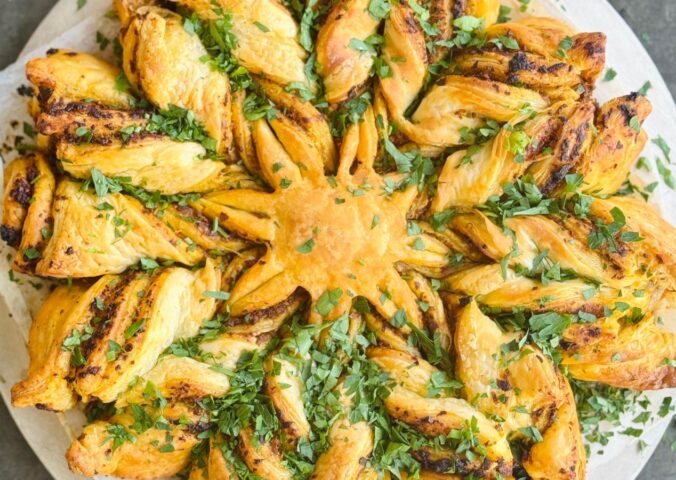 a pesto pastry star made with vegan puff pastry and your choice of pesto