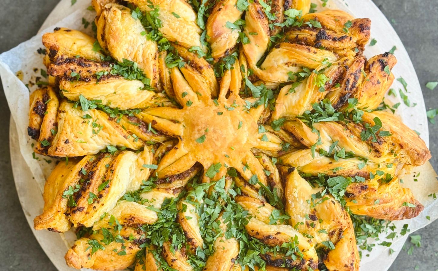 a pesto pastry star made with vegan puff pastry and your choice of pesto