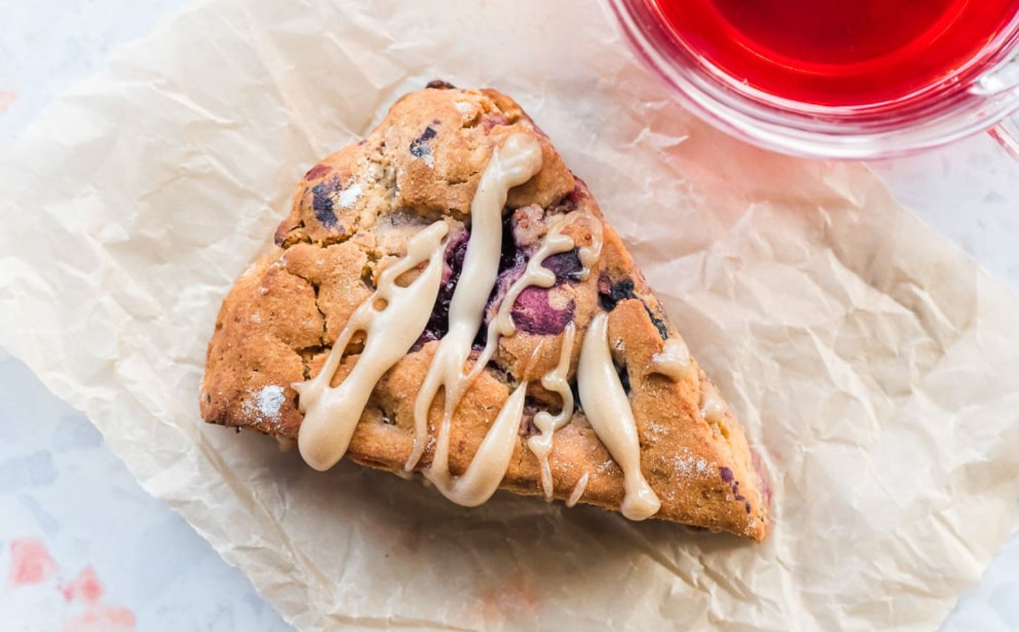 a picture of one of eight plant-based berry scones with lemon hibiscus cashew cream