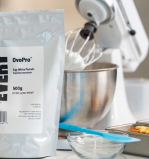 Photo shows a bag of The Every Company's powdered, precision fermented egg protein next to baking equipment and two small cakes