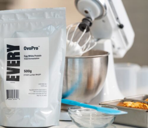 Photo shows a bag of The Every Company's powdered, precision fermented egg protein next to baking equipment and two small cakes