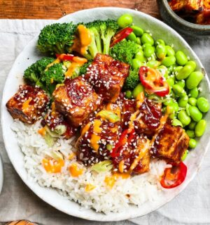 sticky gochujang tofu bowl with edamame, broccoli, and kimchi
