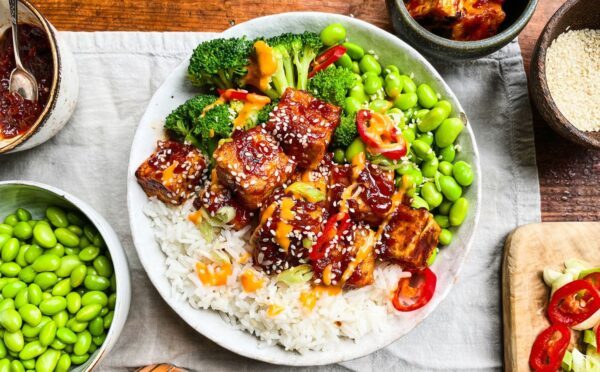sticky gochujang tofu bowl with edamame, broccoli, and kimchi