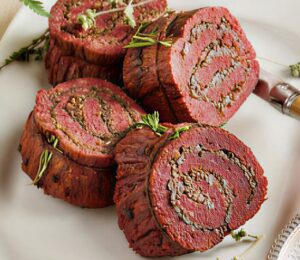 stuffed flank steak with mushrooms and mulled wine shallots