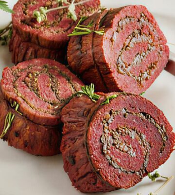 stuffed flank steak with mushrooms and mulled wine shallots