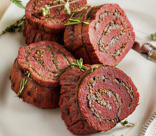 stuffed flank steak with mushrooms and mulled wine shallots
