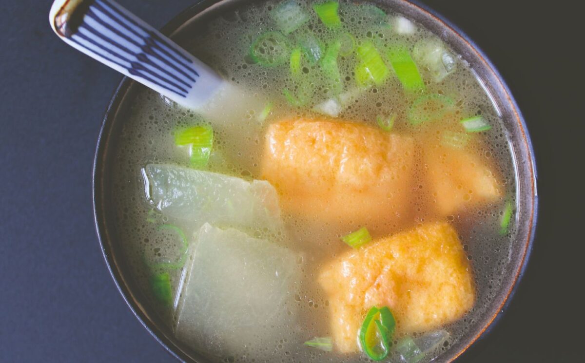 winter melon soup with tofu puffs with spring onion and a simple broth