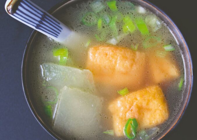 winter melon soup with tofu puffs with spring onion and a simple broth