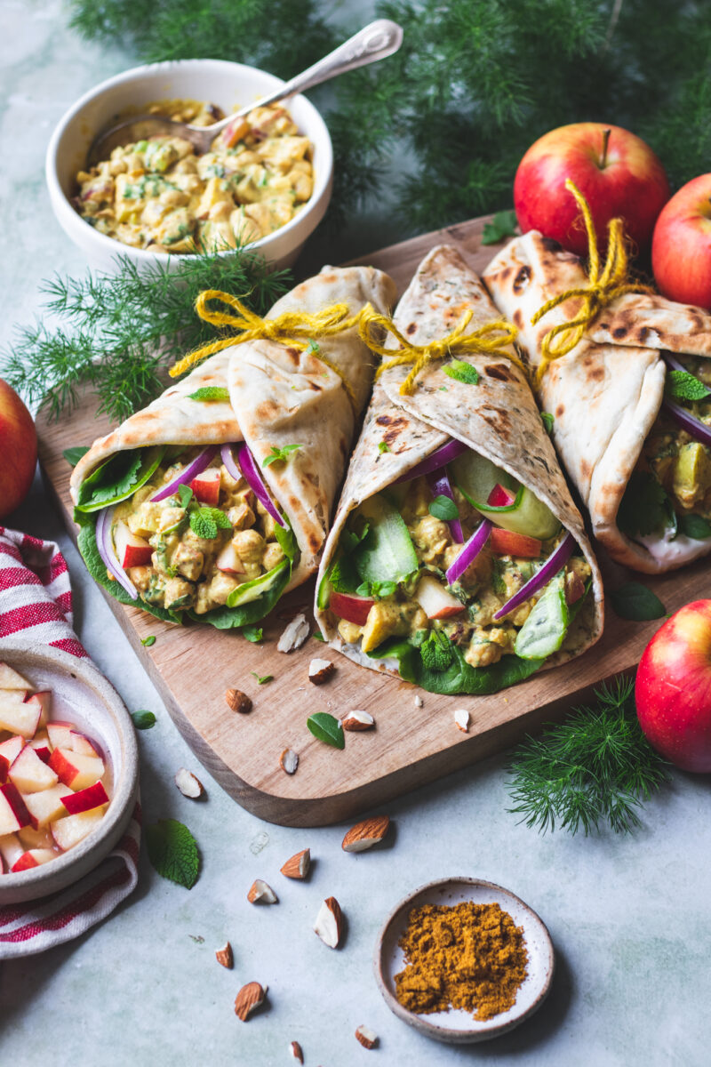Christmas coronation chickpea naan wraps with vegan yogurt, chickpeas, dried cranberries, apple, and more