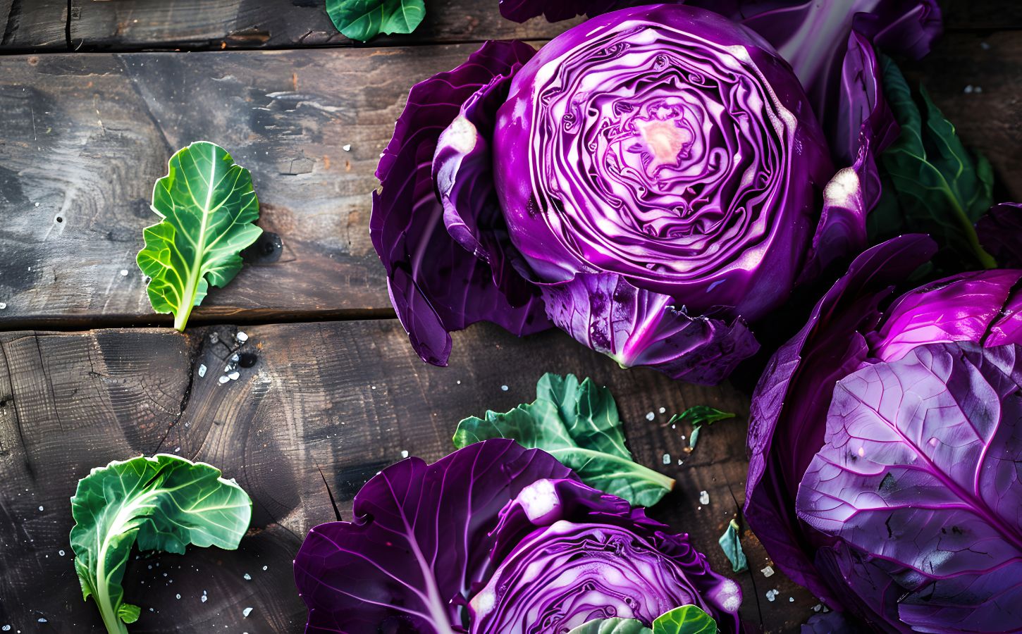 Three heads of purple cabbage on a rustic wooden table, highlighting the health benefits of purple cabbage