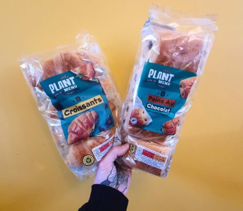 Photo shows someone's hand holding up packs of the popular Aldi vegan croissants, which the supermarket lhas brought back for Veganuary 2026