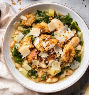a bowl of rustic white bean and kale soup with homemade croutons for quick cold weather meals