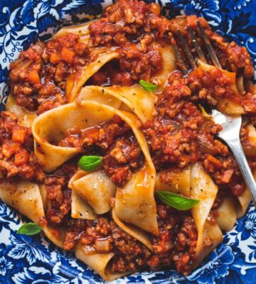 vegan classic Bolognese made with ragu-style tomato sauce and topped over pappardelle pasta for high-protein pasta dishes