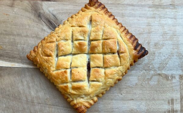 copycat Greggs vegan lattice pastry festive edition with vegan chicken, bacon, stuffing, and cranberry sauce wrapped in vegan puff pastry