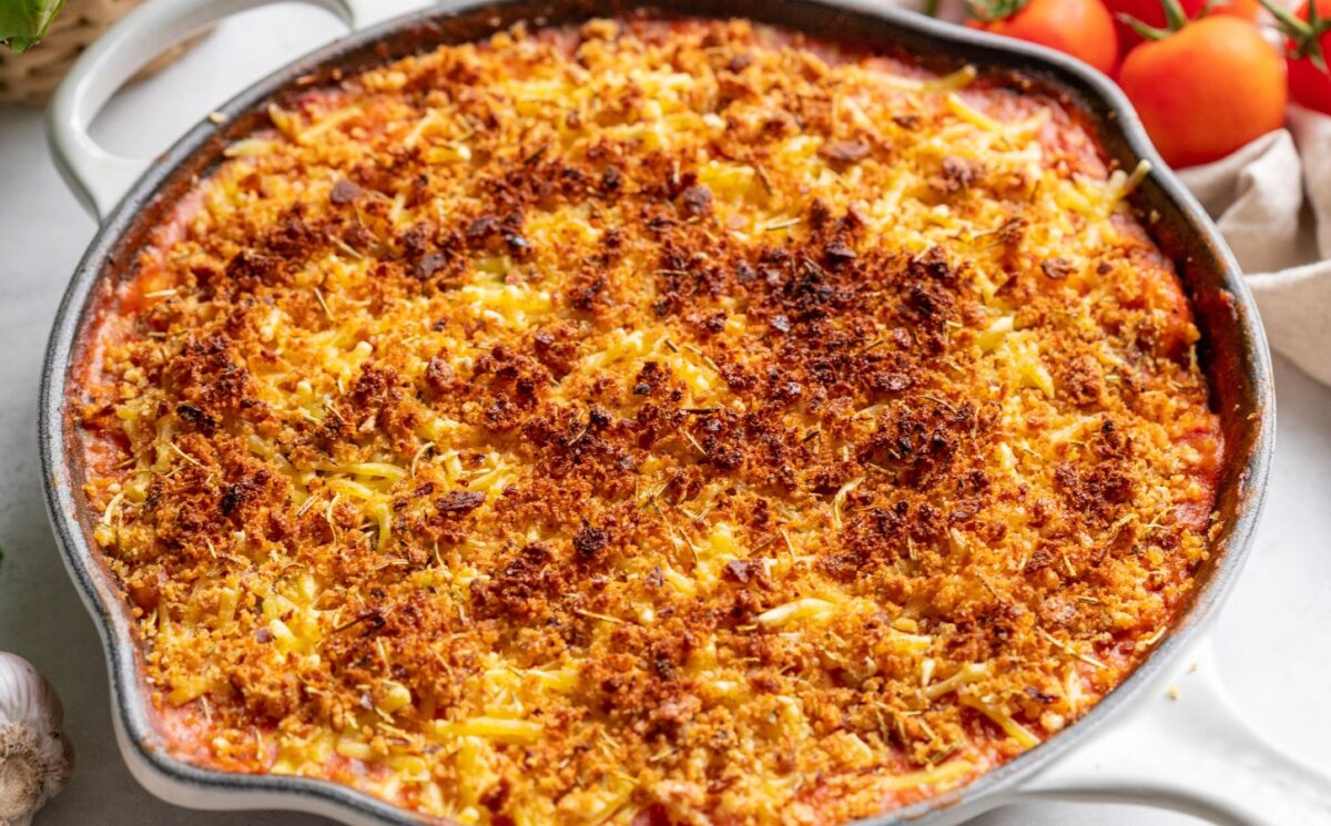 creamy one-pot vegan gnocchi bake with tomato, coconut milk, and dairy-free cheese