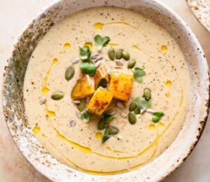 creamy roasted gold potato leek soup with coconut milk, nutritional yeast and pumpkin seeds