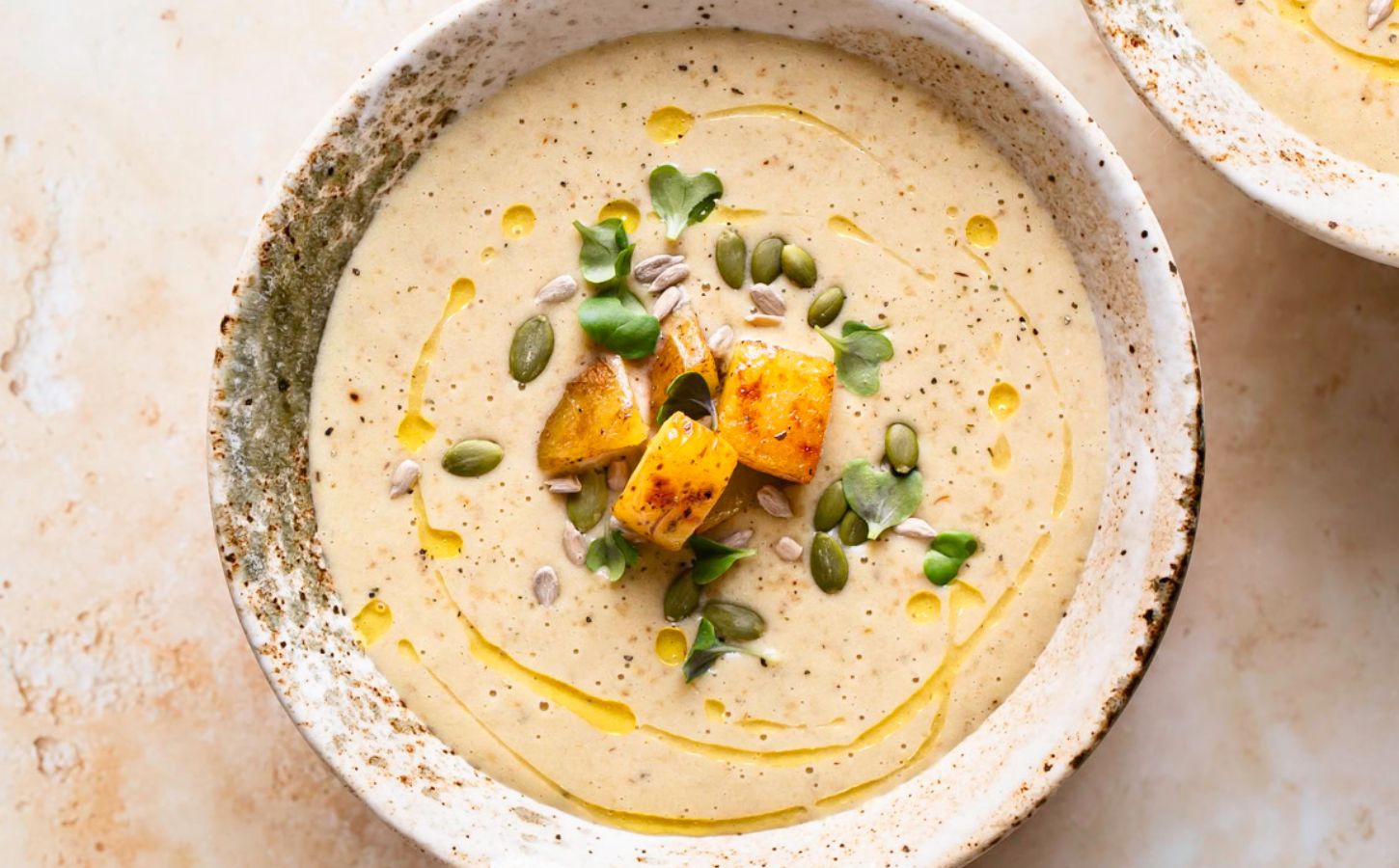 creamy roasted gold potato leek soup with coconut milk, nutritional yeast and pumpkin seeds