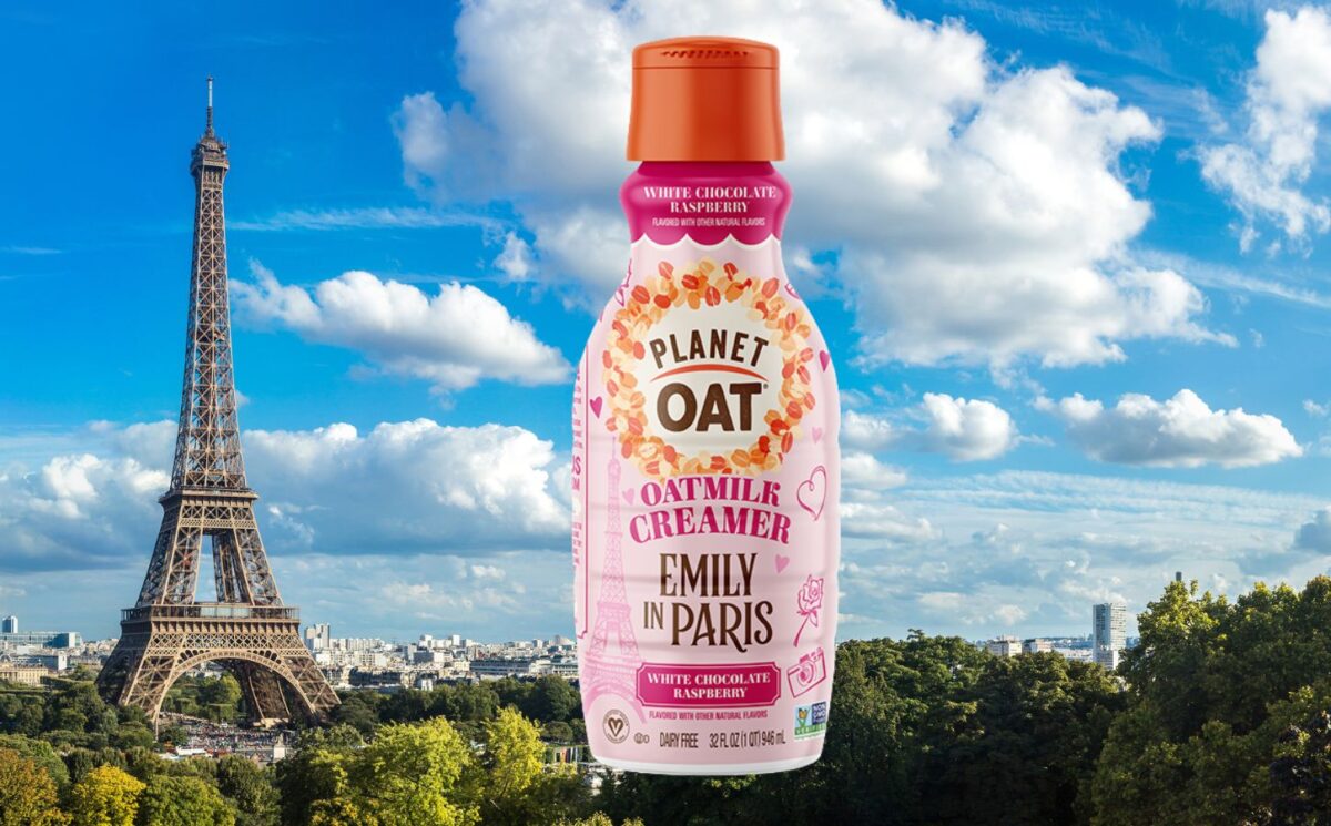 Photo shows the vegan Emily in Paris x Planet Oat white chocolate and raspberry oat milk creamer against a backdrop of Paris, France