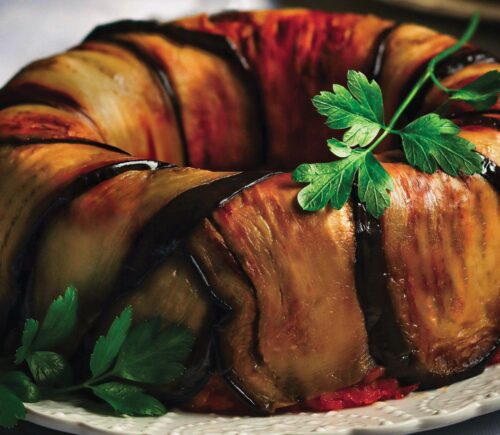 a timbalo made with eggplant and tomato rice bake and vegan mozzarella for gluten-free holiday recipes