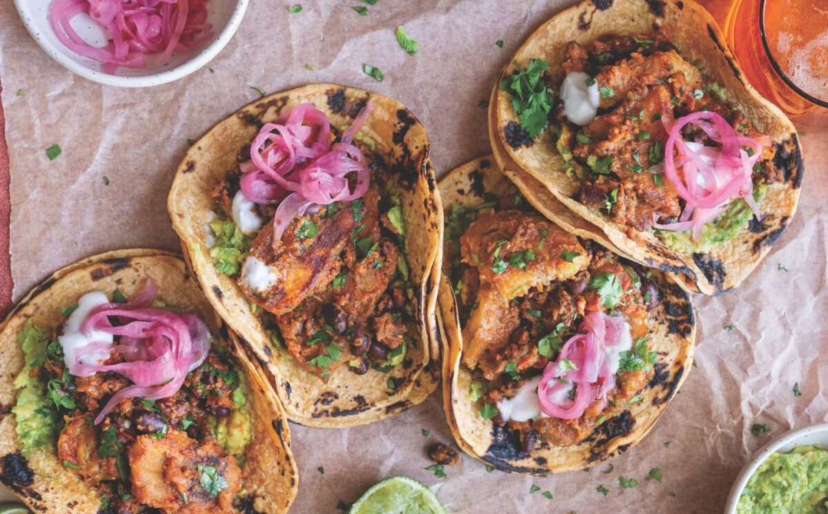 a picture of plantain and black bean tacos made with charred poblano sauce for Jamaican and Caribbean-inspired recipes