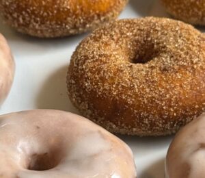mini sweet potato donuts with orange sweet potato, and icing or cinnamon sugar