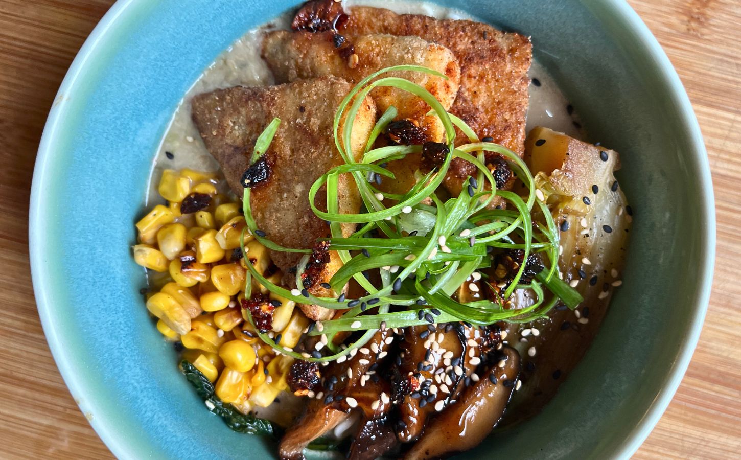 plant-based miso tofu bowl with tofu, mushrooms, corn, spring onion and more